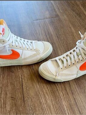 Nike High-Top Sneakers in White with Bright Orange Swoosh